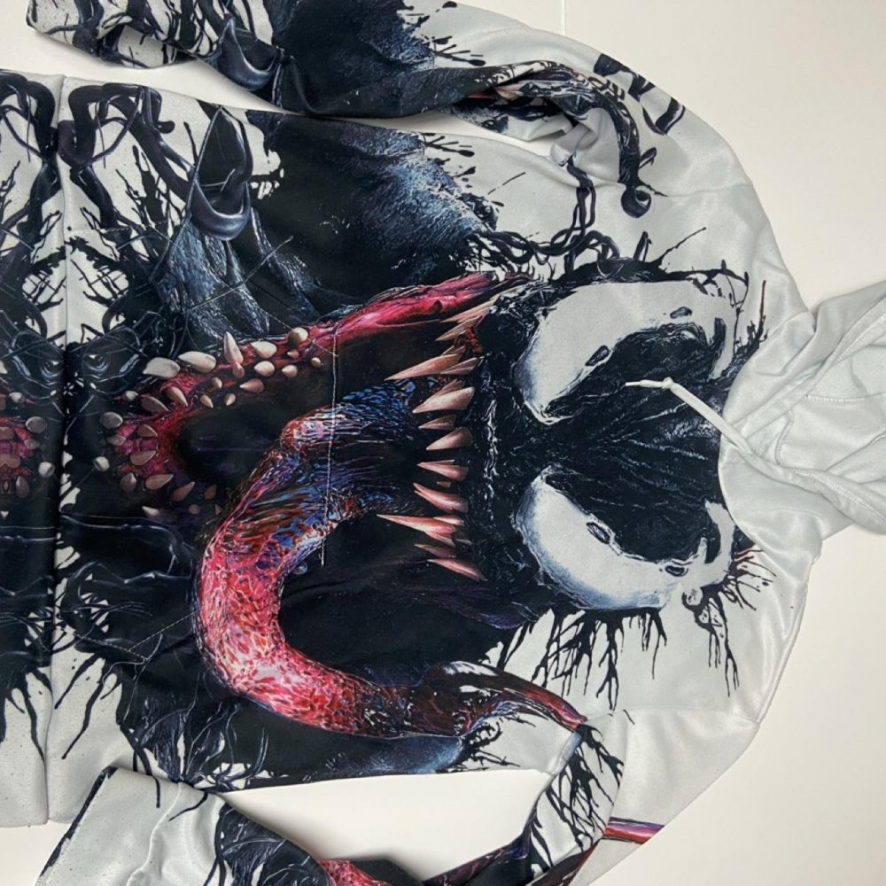Marvel Venom hoodie with graphic of a black and red Venom character with sharp t